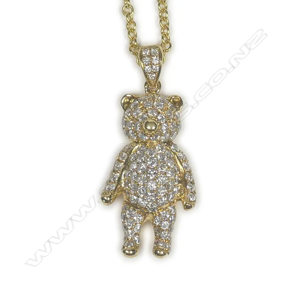 An 18ct yellow gold and diamond set teddy bear pendant on 18ct chain Image 1++