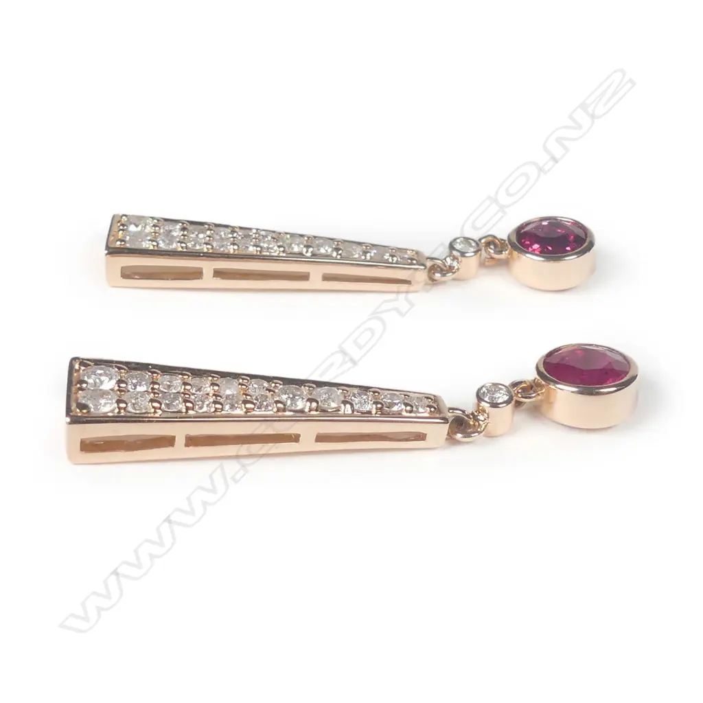 A pair of 14ct rose gold ruby and diamond drop earrings Image 1++
