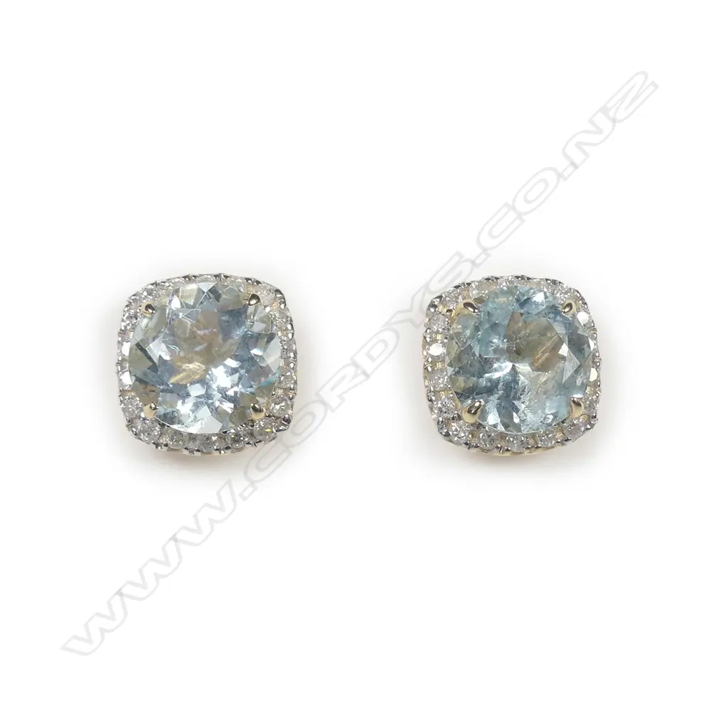 A pair of 14ct yellow gold aquamarine and diamond halo stud earrings Image 1++
