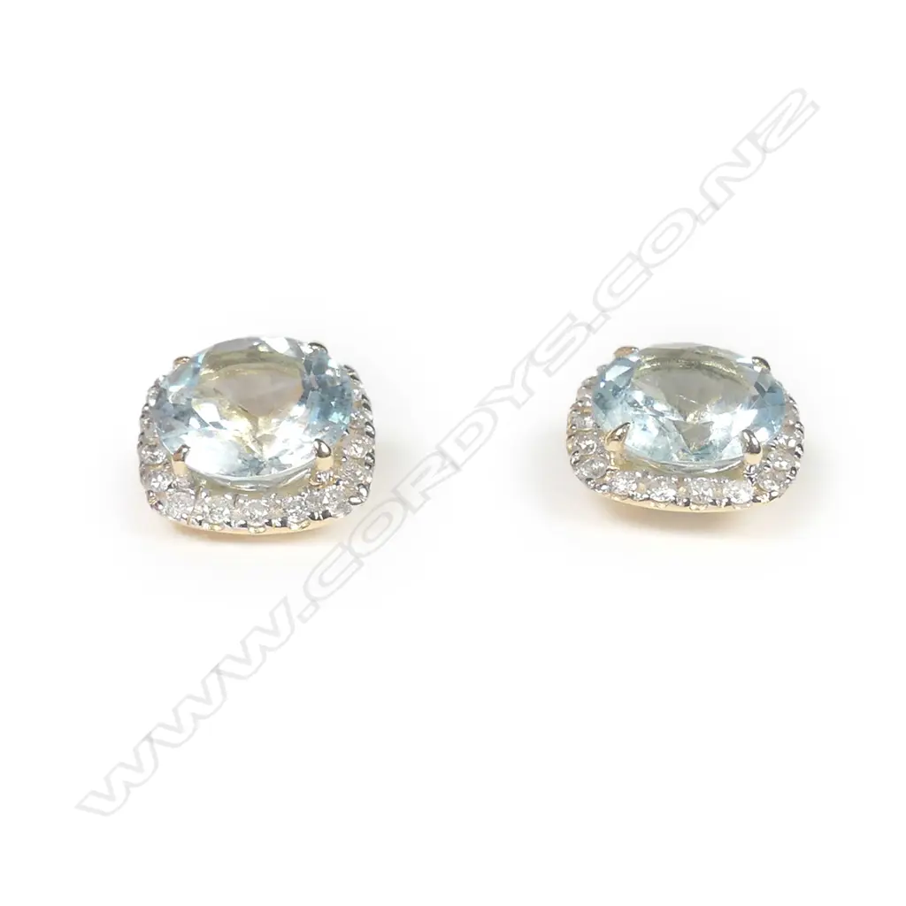 A pair of 14ct yellow gold aquamarine and diamond halo stud earrings Image 1++