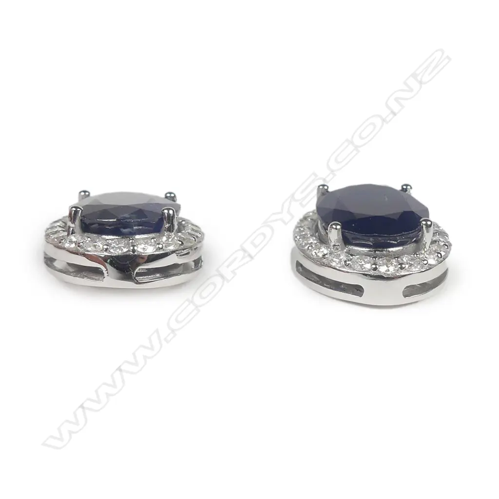 A pair of14ct white gold sapphire and diamond stud earrings Image 1++