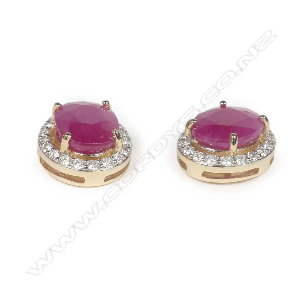 A pair of 14ct yellow and white gold ruby and diamond halo earrings Image 1++