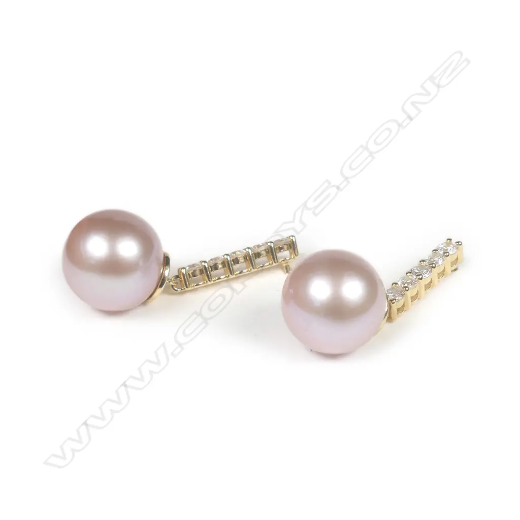 A pair of 14ct yellow gold pearl and diamond drop earrings Image 1++