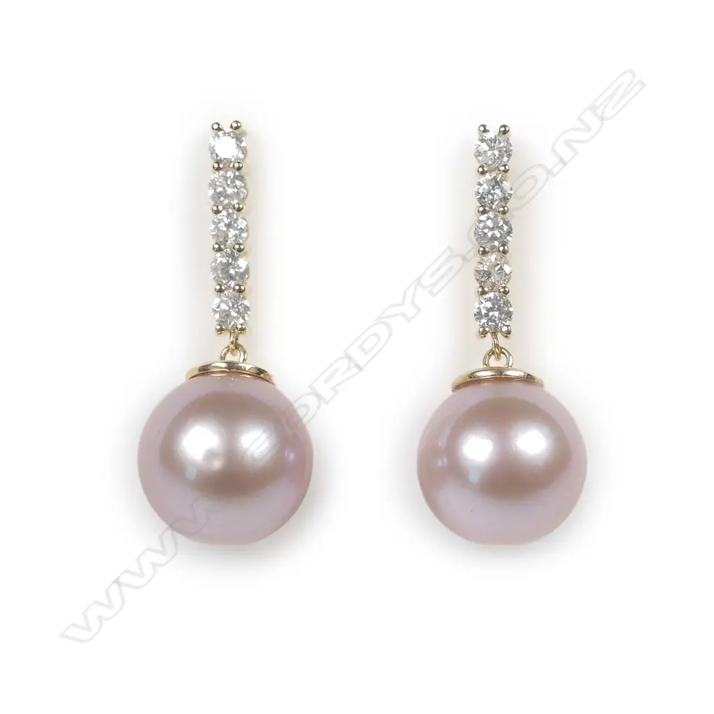 A pair of 14ct yellow gold pearl and diamond drop earrings Image 1++