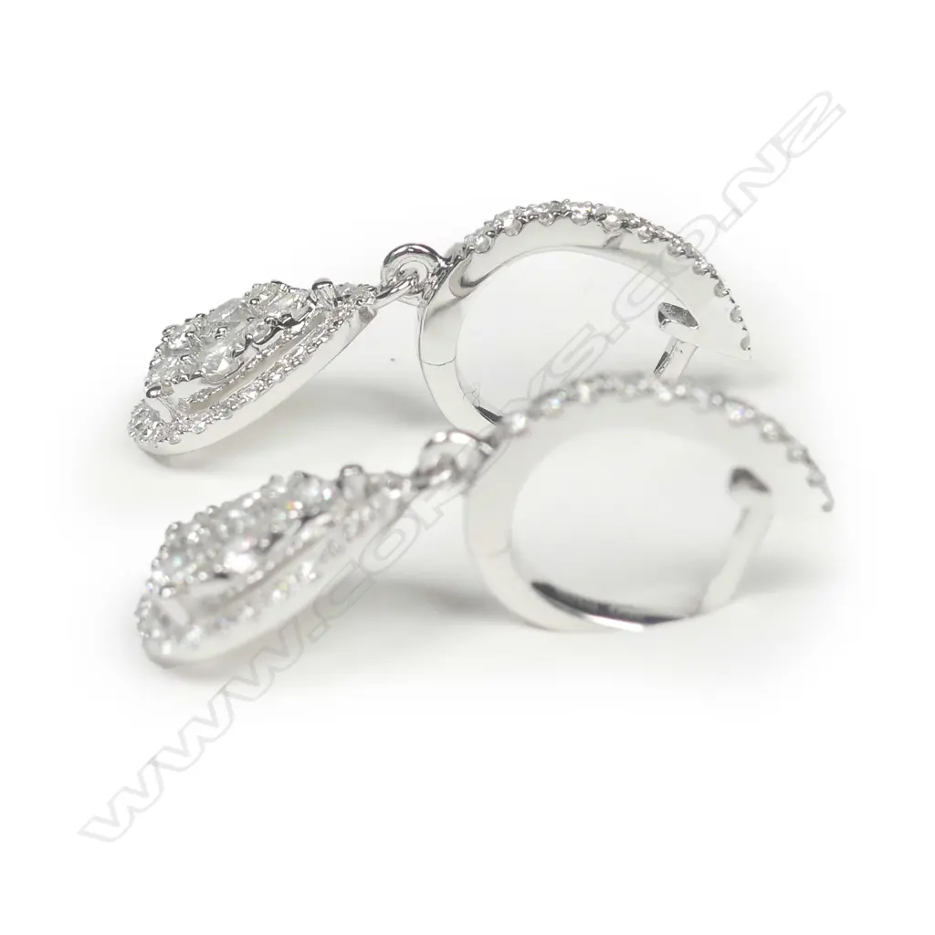 A pair of 18ct white gold diamond cluster earrings Image 1++