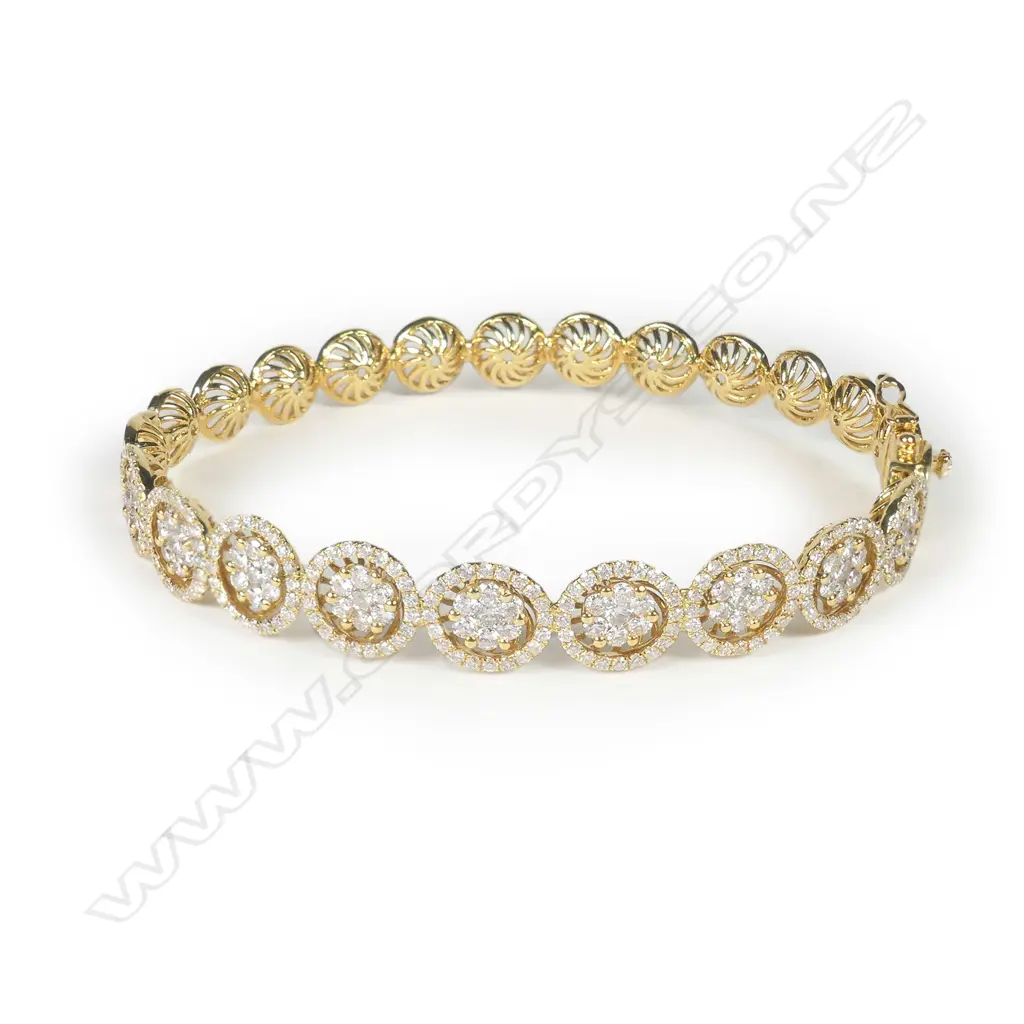 An 18ct gold and diamond hinged bangle Image 1++