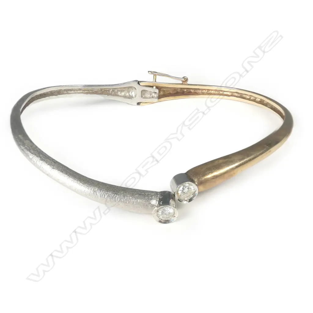 A 9ct white and yellow gold diamond hinged bangle Image 1++