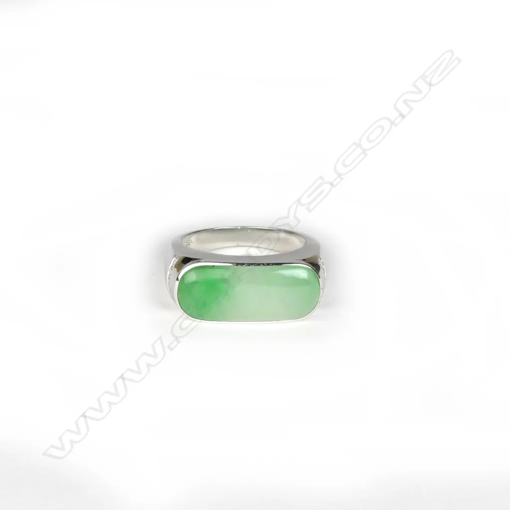 A modern 18ct. white gold jadeite and diamond dress ring Image 1++
