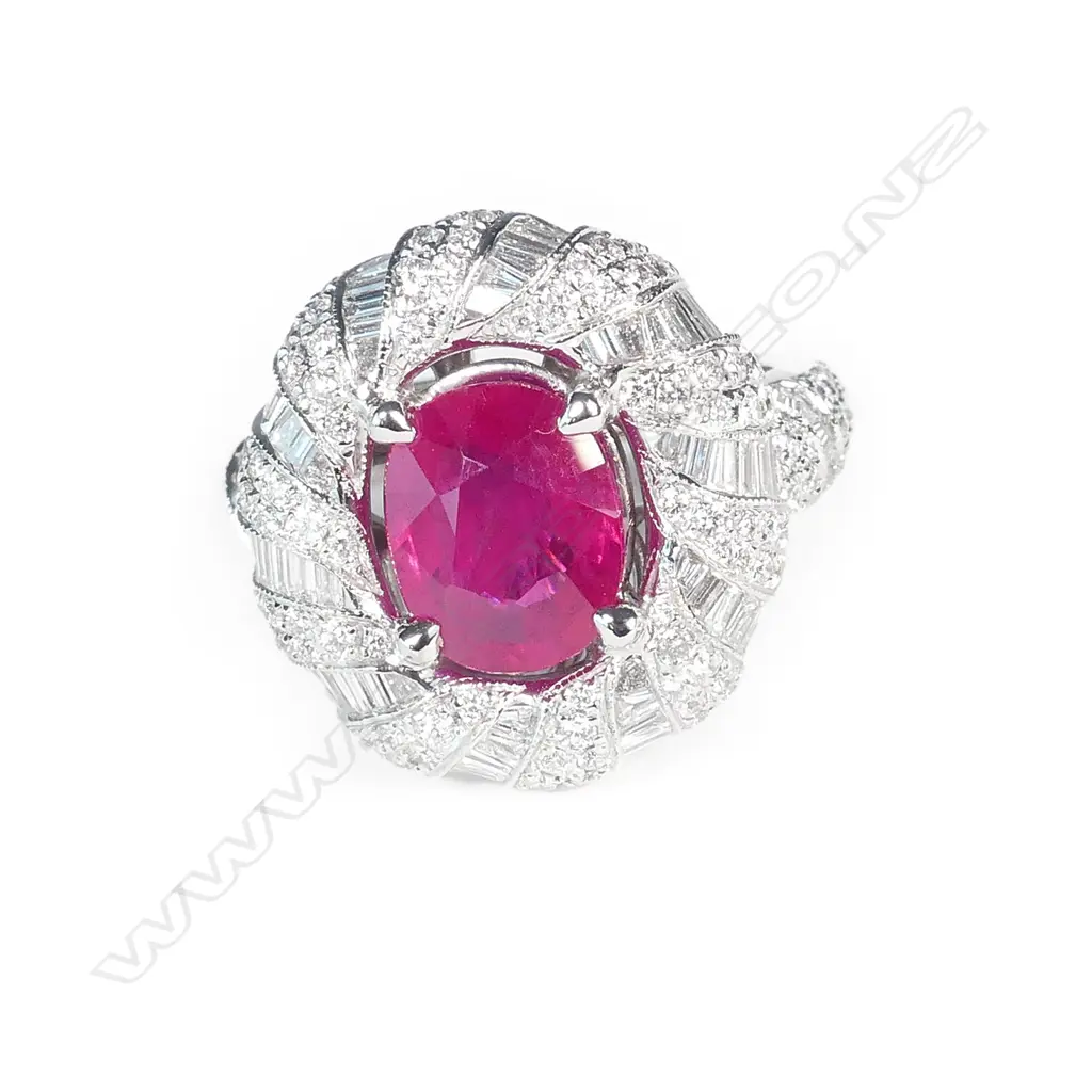 A vibrant 18ct white gold ruby and diamond dress ring Image 1++