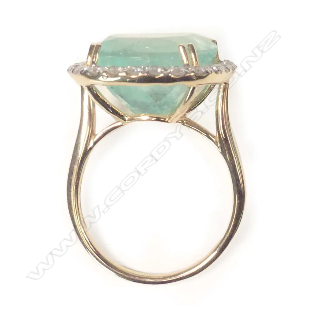 A 14ct gold emerald and diamond ring Image 1++
