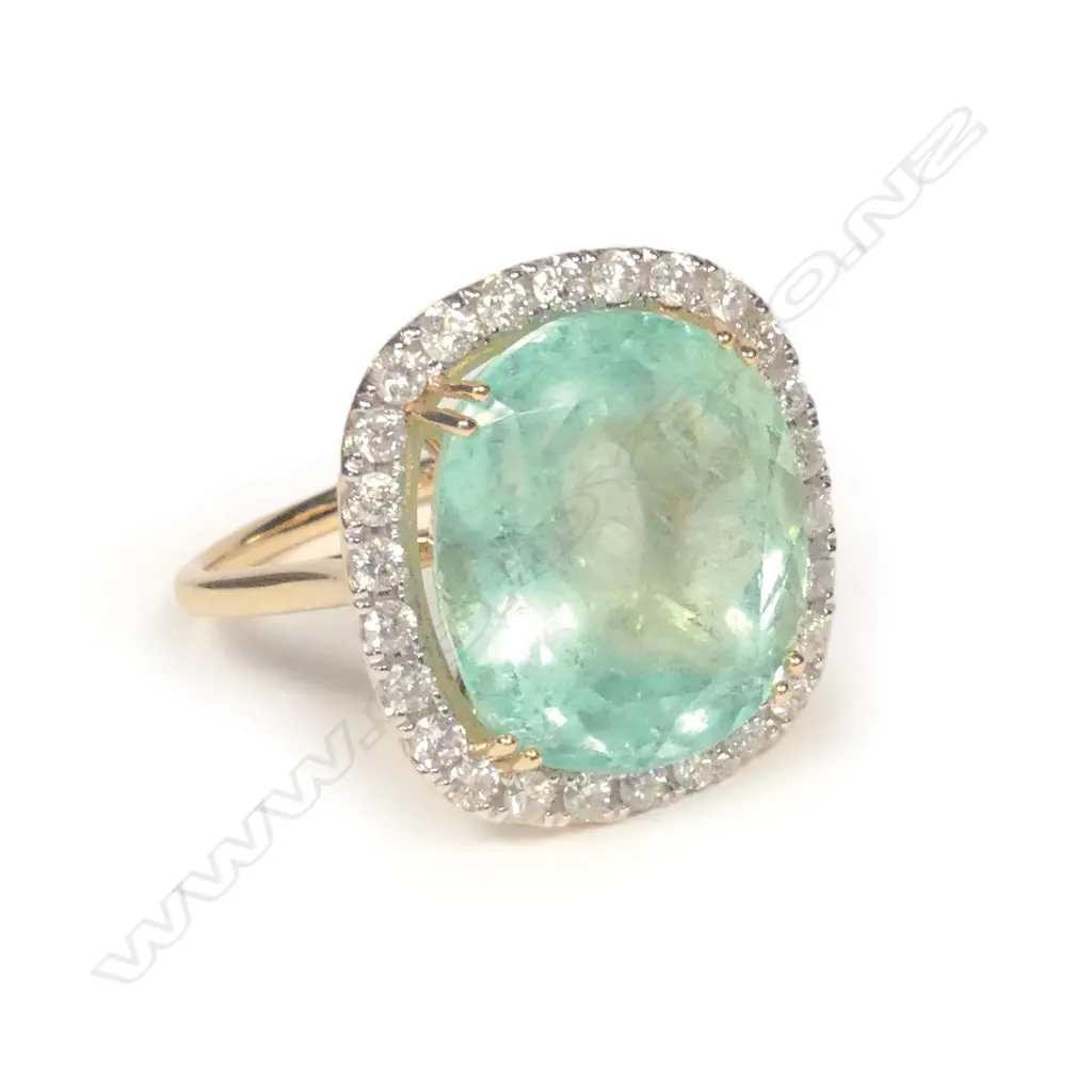 A 14ct gold emerald and diamond ring Image 1++