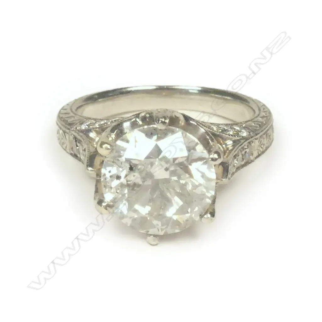 A platinum and diamond ring Image 1++