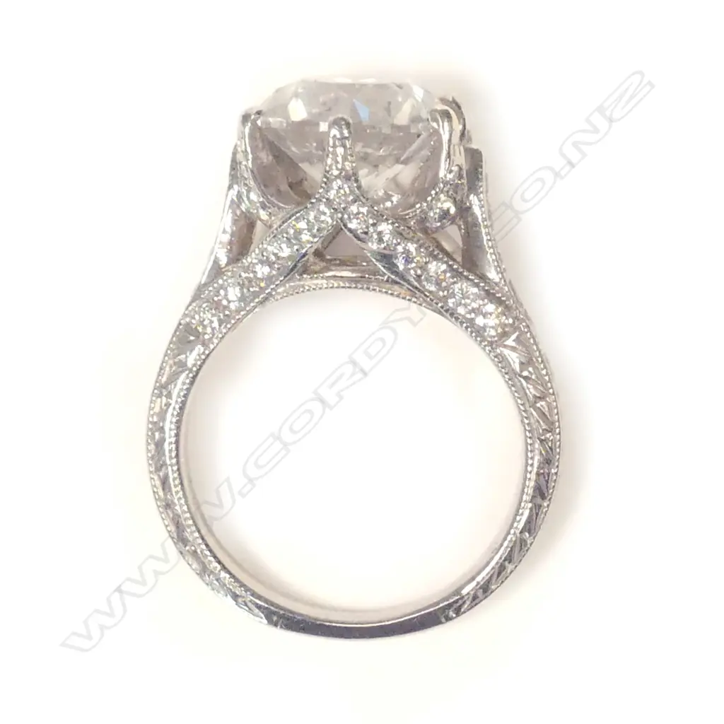 A platinum and diamond ring Image 1++