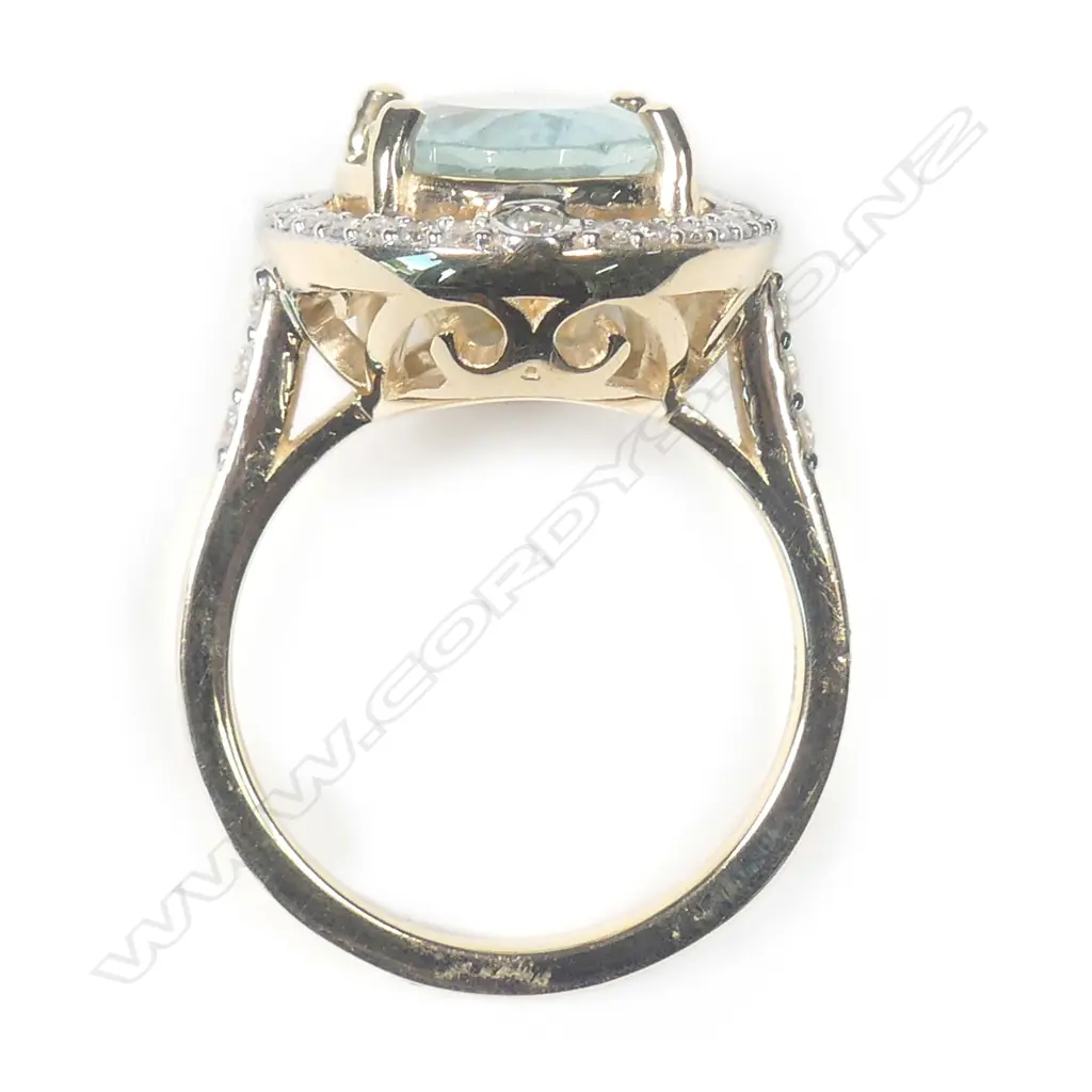 A 14ct yellow gold aquamarine and diamond ring Image 1++