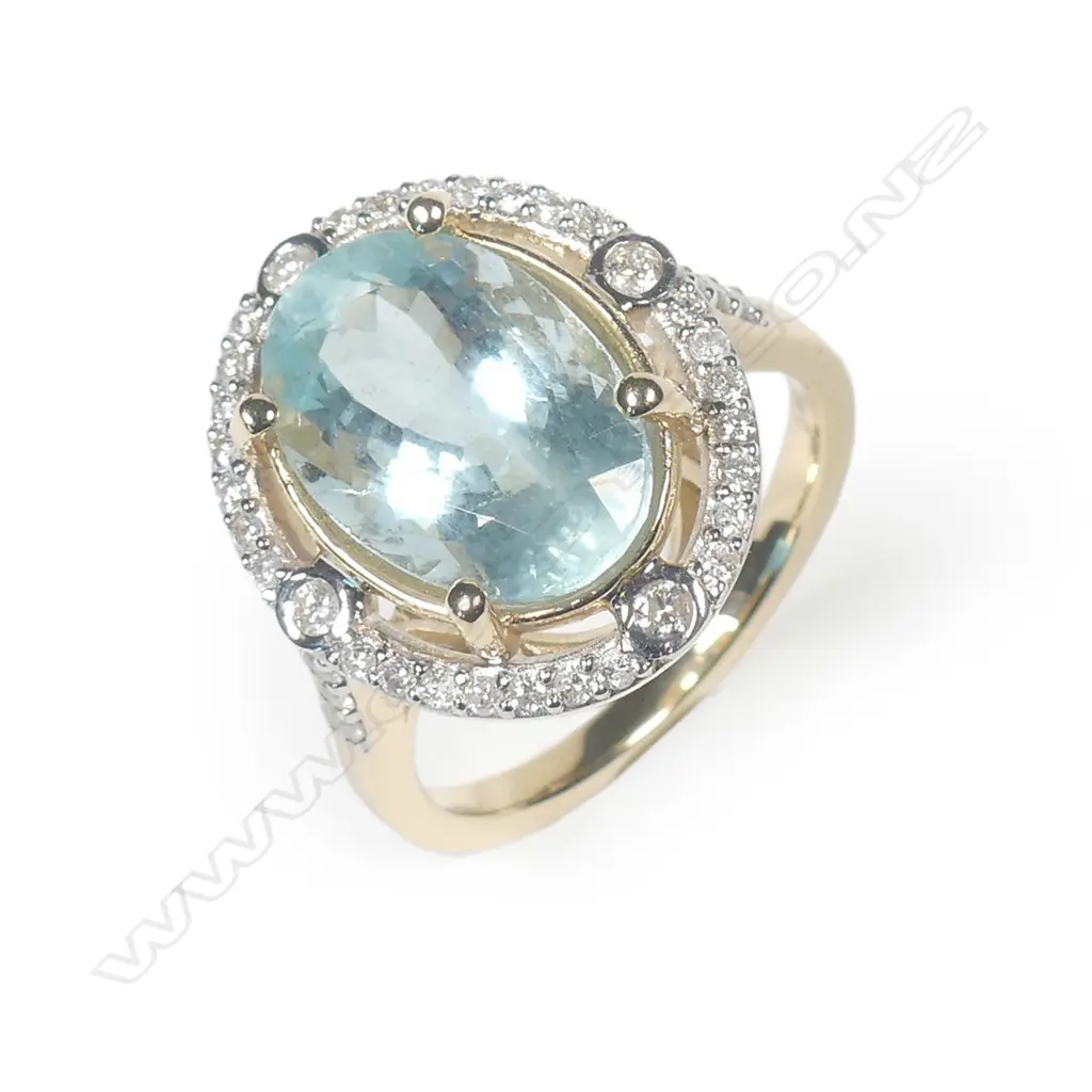 A 14ct yellow gold aquamarine and diamond ring Image 1++
