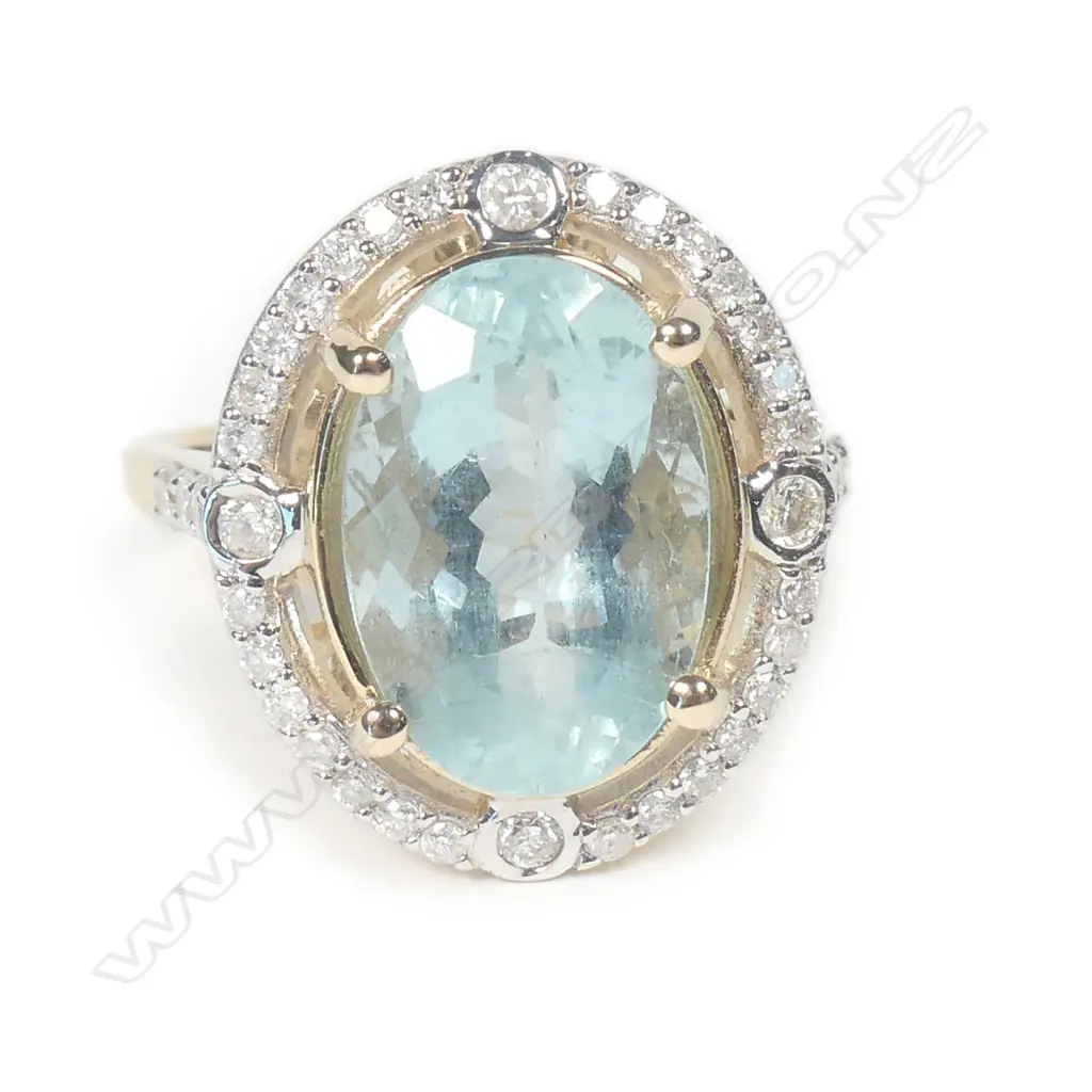 A 14ct yellow gold aquamarine and diamond ring Image 1++