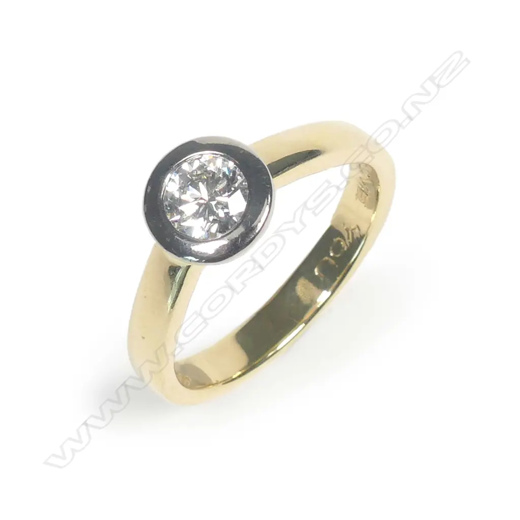 An 18ct gold and diamond solitaire ring Image 1++