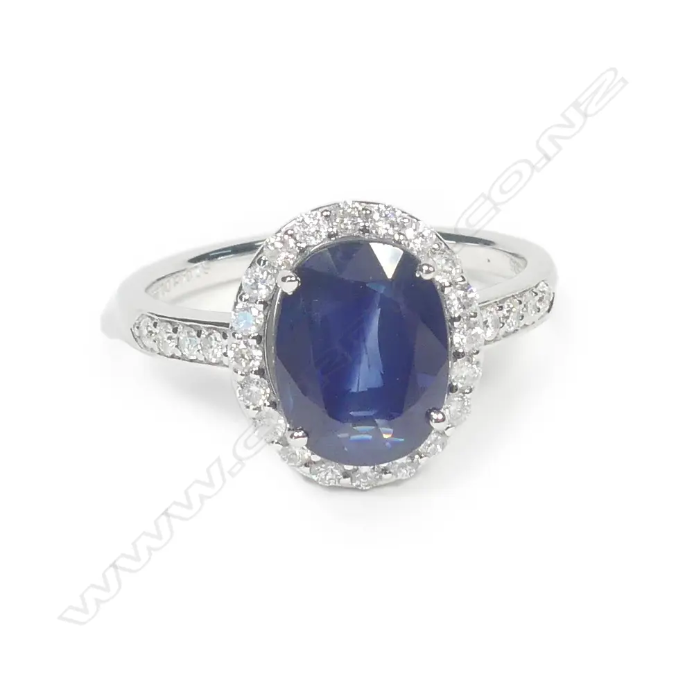 A 14ct white gold sapphire and diamond ring Image 1++