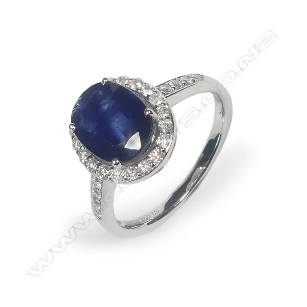 A 14ct white gold sapphire and diamond ring Image 1++