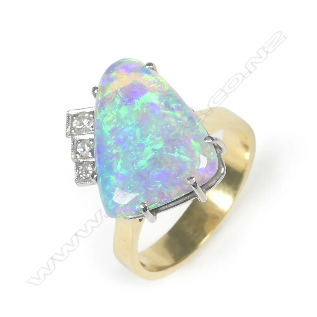 An 18ct yellow gold solid boulder opal and diamond ring Image 1++
