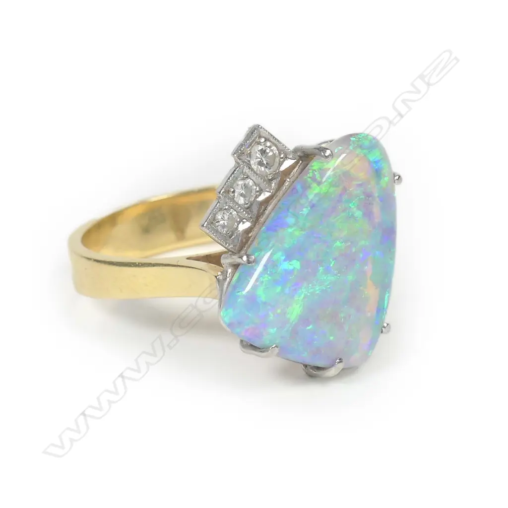 An 18ct yellow gold solid boulder opal and diamond ring Image 1++