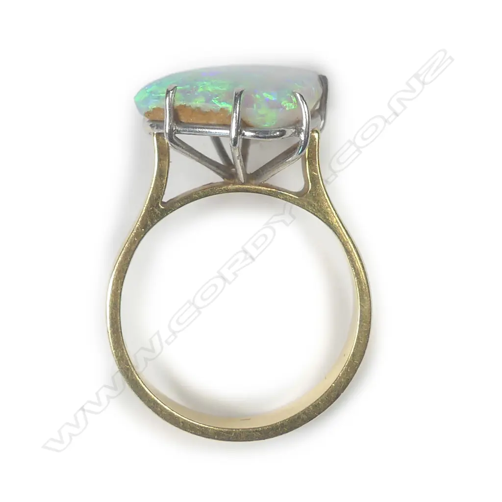 An 18ct yellow gold solid boulder opal and diamond ring Image 1++