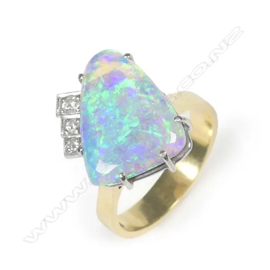 An 18ct yellow gold solid boulder opal and diamond ring