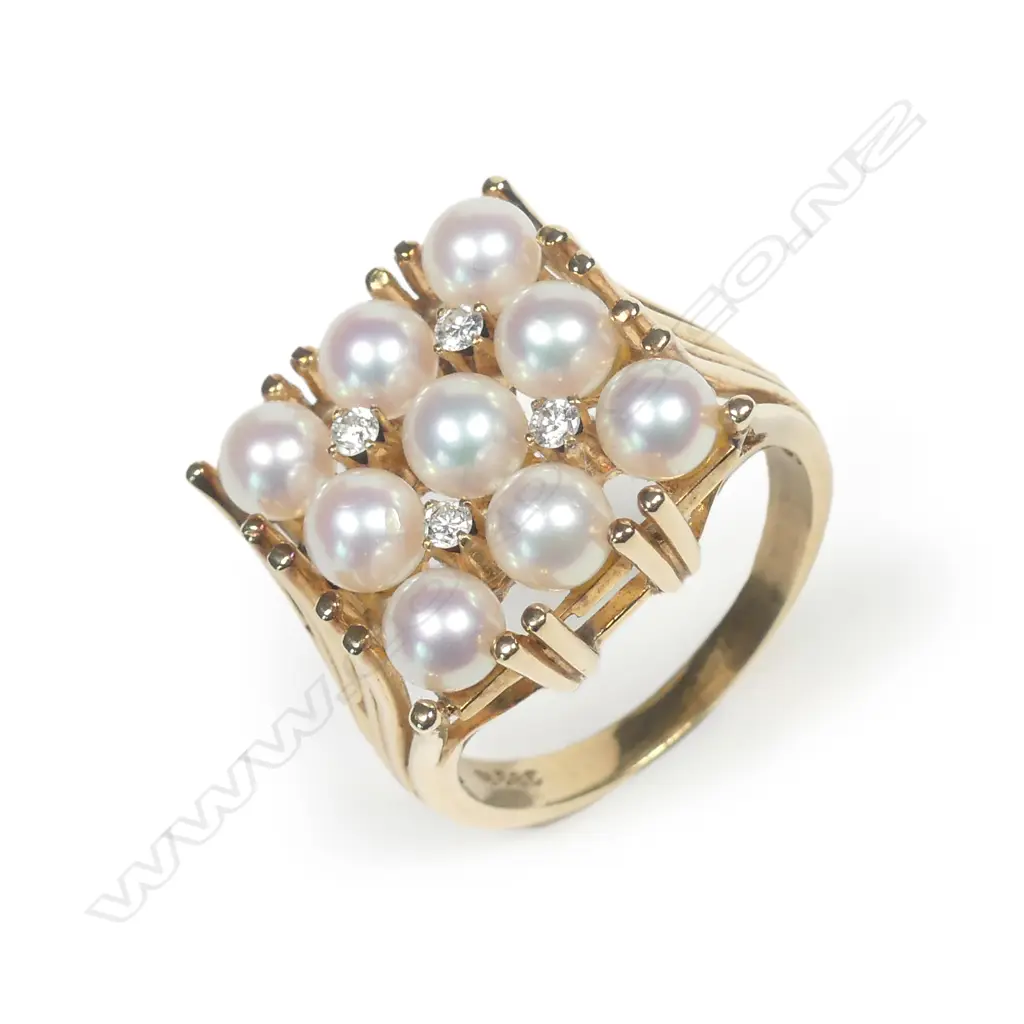 A 14ct gold pearl and diamond ring Image 1++
