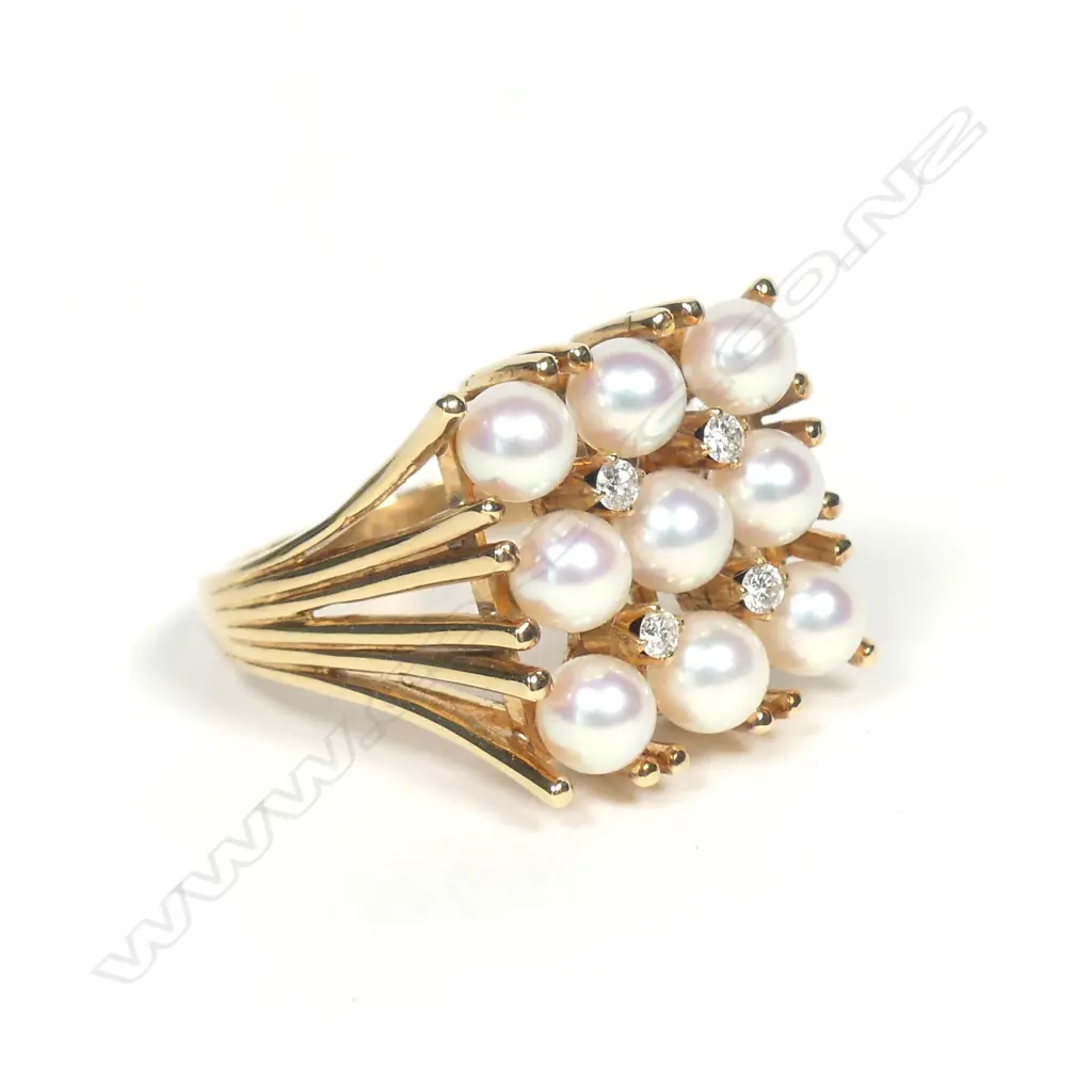 A 14ct gold pearl and diamond ring Image 1++