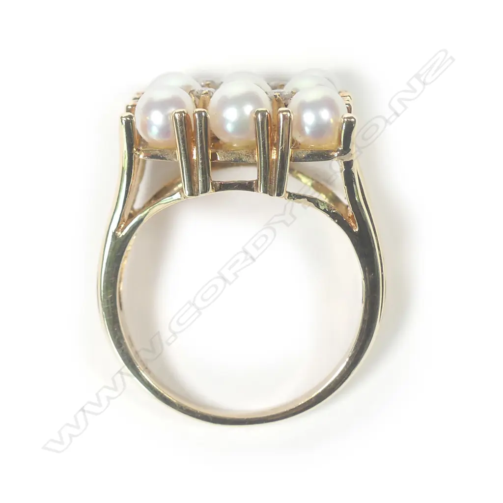 A 14ct gold pearl and diamond ring Image 1++