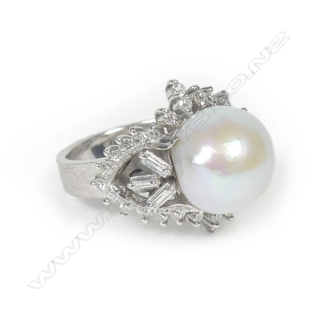 An 18ct white gold pearl and diamond ring Image 1++