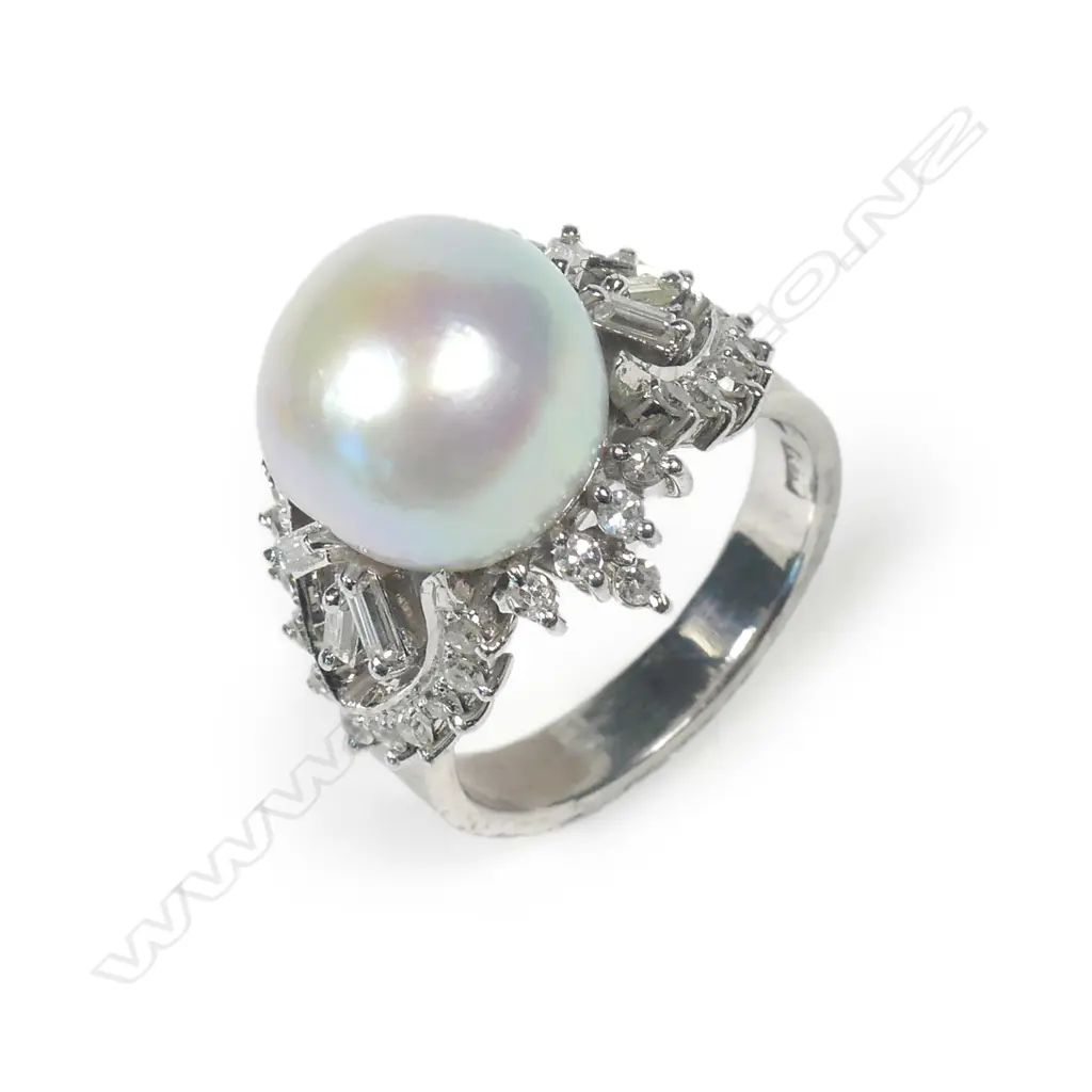 An 18ct white gold pearl and diamond ring Image 1++