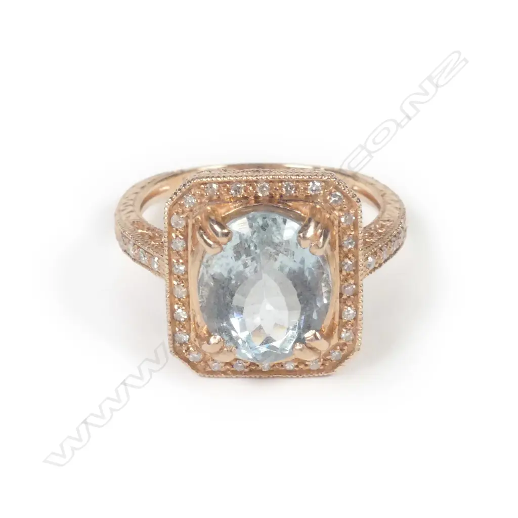A 14ct rose gold aquamarine & diamond ring Image 1++