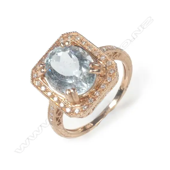 A 14ct rose gold aquamarine & diamond ring