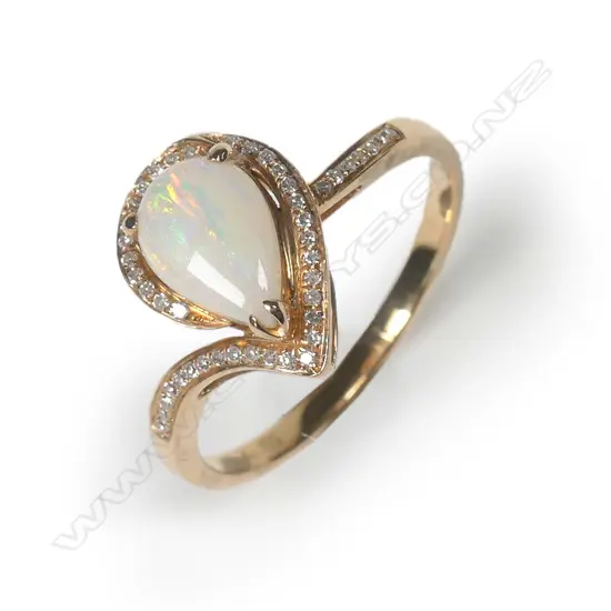 An 18ct rose gold opal and diamond ring