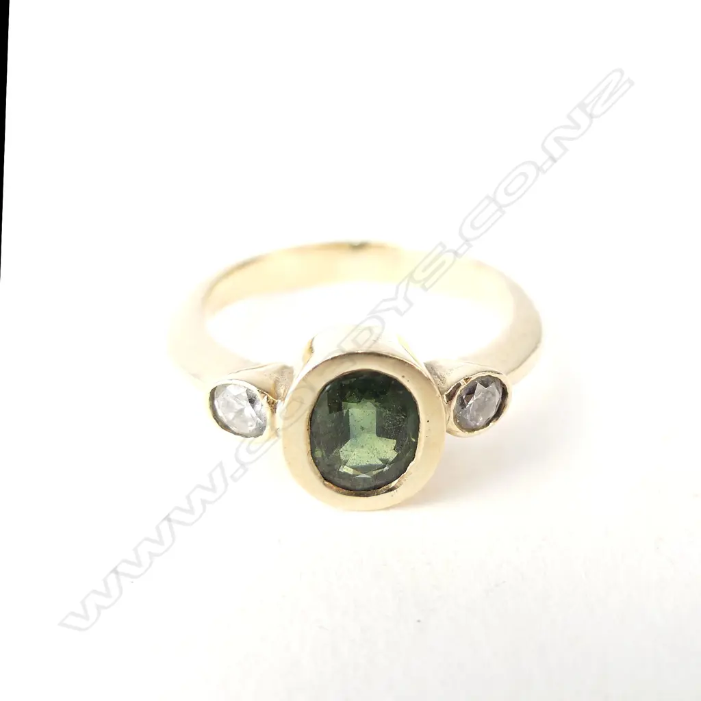 A 9ct gold green sapphire and diamond ring Image 1++