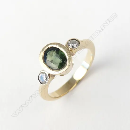 A 9ct gold green sapphire and diamond ring