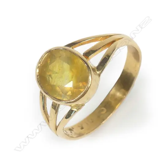 A 22ct yellow gold and golden sapphire ring