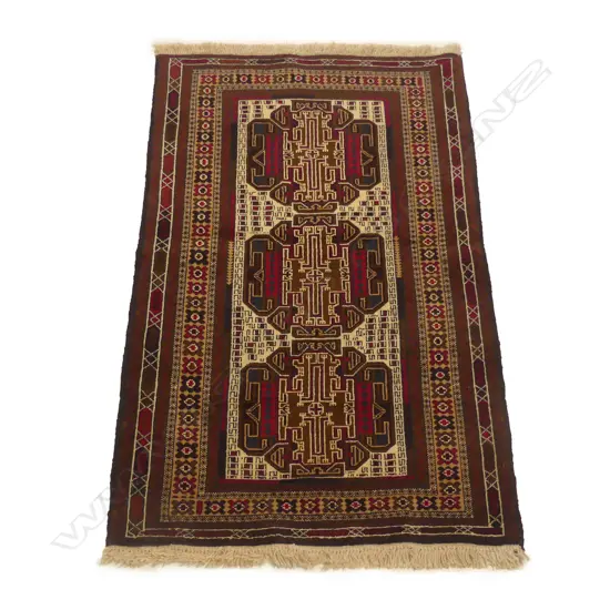 A hand knotted tribal Balouchi rug