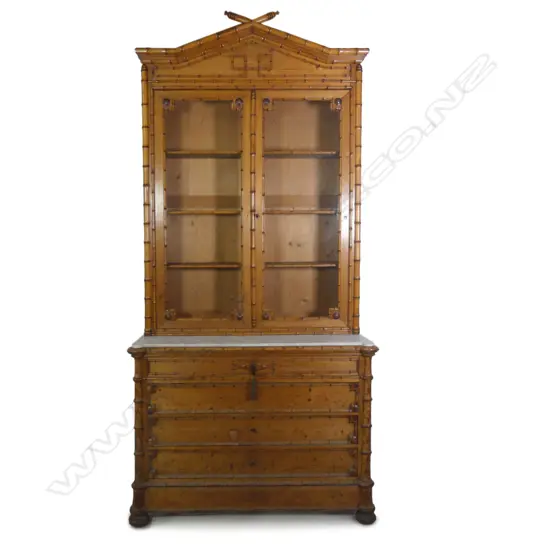 A 19thC French pine faux bamboo bookcase on commode