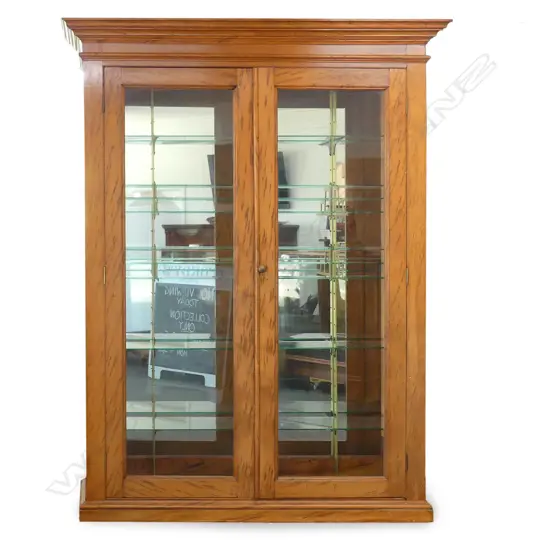 A colonial burr kauri display cabinet