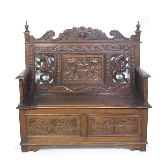 An early 1900s oak hall seat