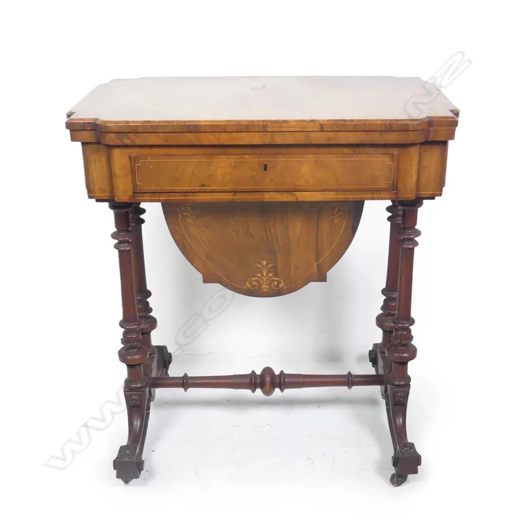 A Victorian walnut games table Image 1++