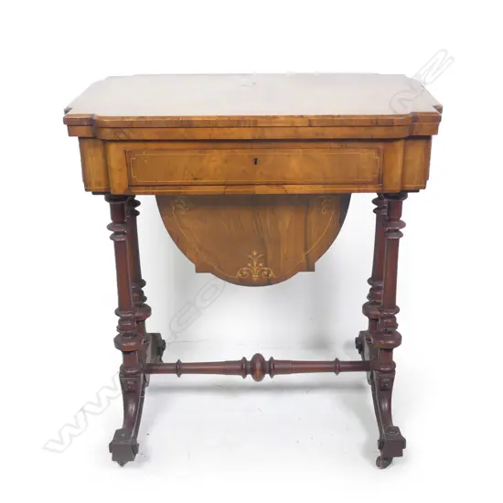 A Victorian walnut games table