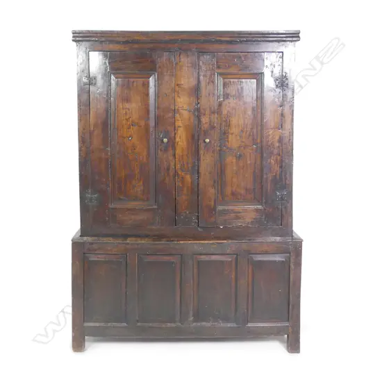 An 18thC Georgian country oak livery cupboard on stand
