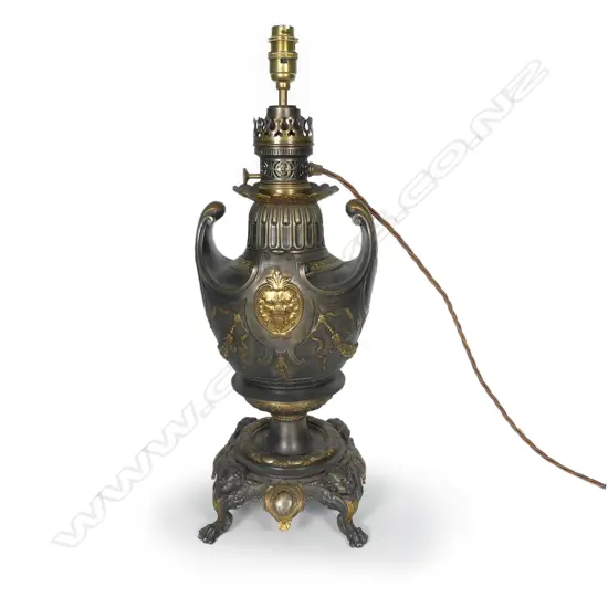 An ornate French converted kerosene lamp