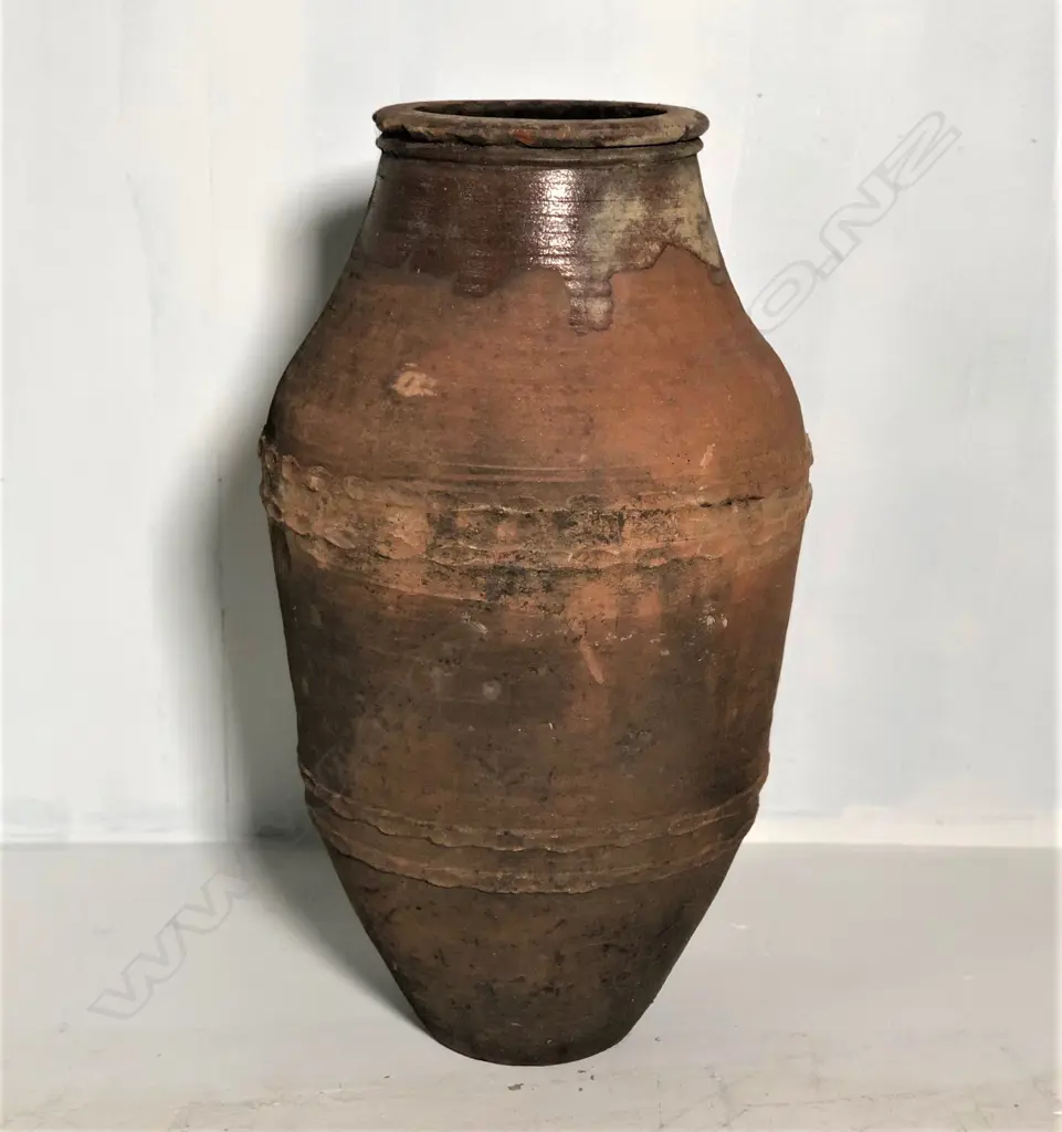 An old European terracotta tall olive oil storage jar Image 1++