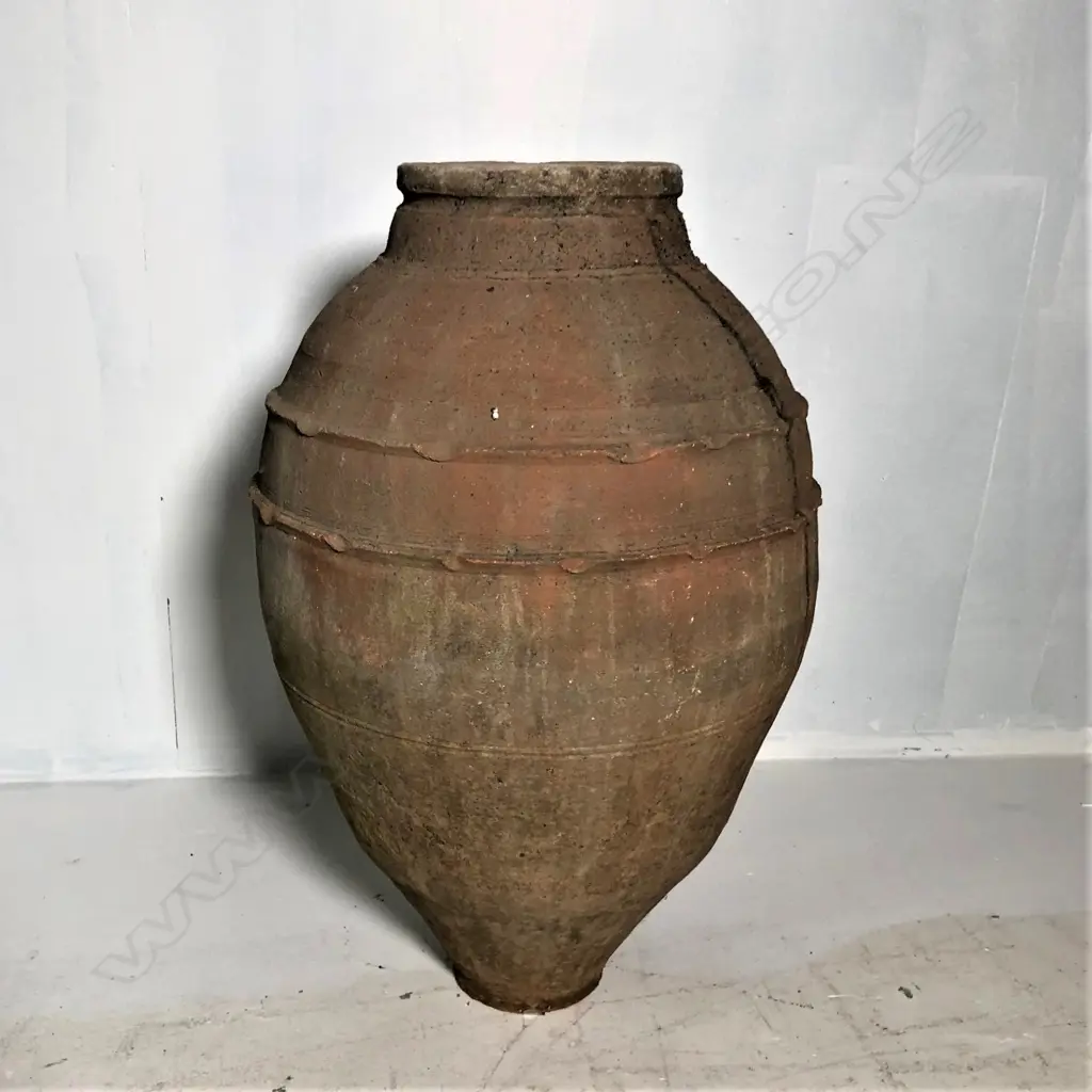 An old European terracotta tall olive oil storage jar Image 1++