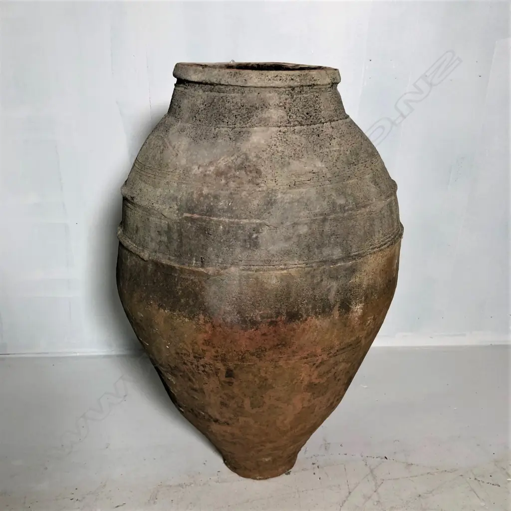 An old European terracotta tall olive oil storage jar Image 1++