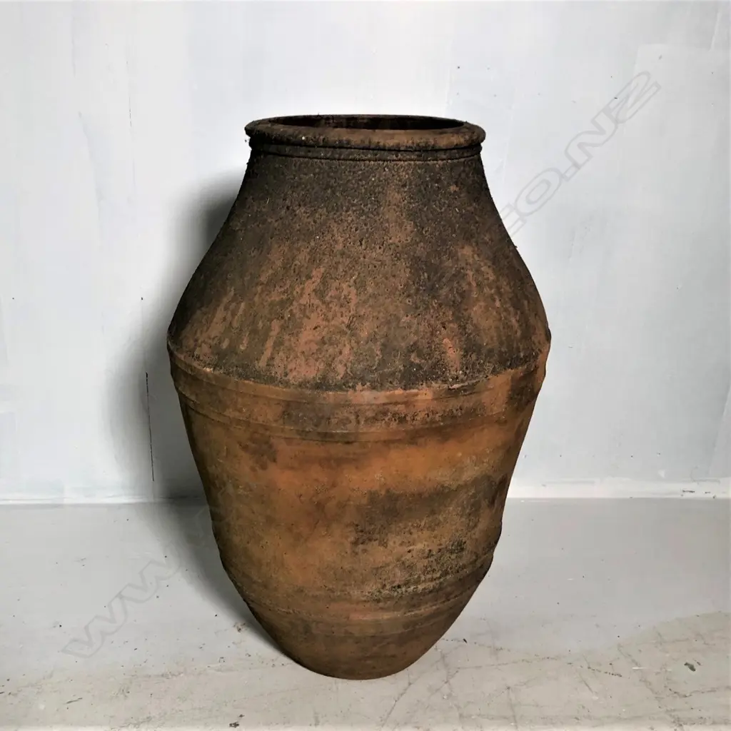 An old European terracotta tall olive oil storage jar Image 1++